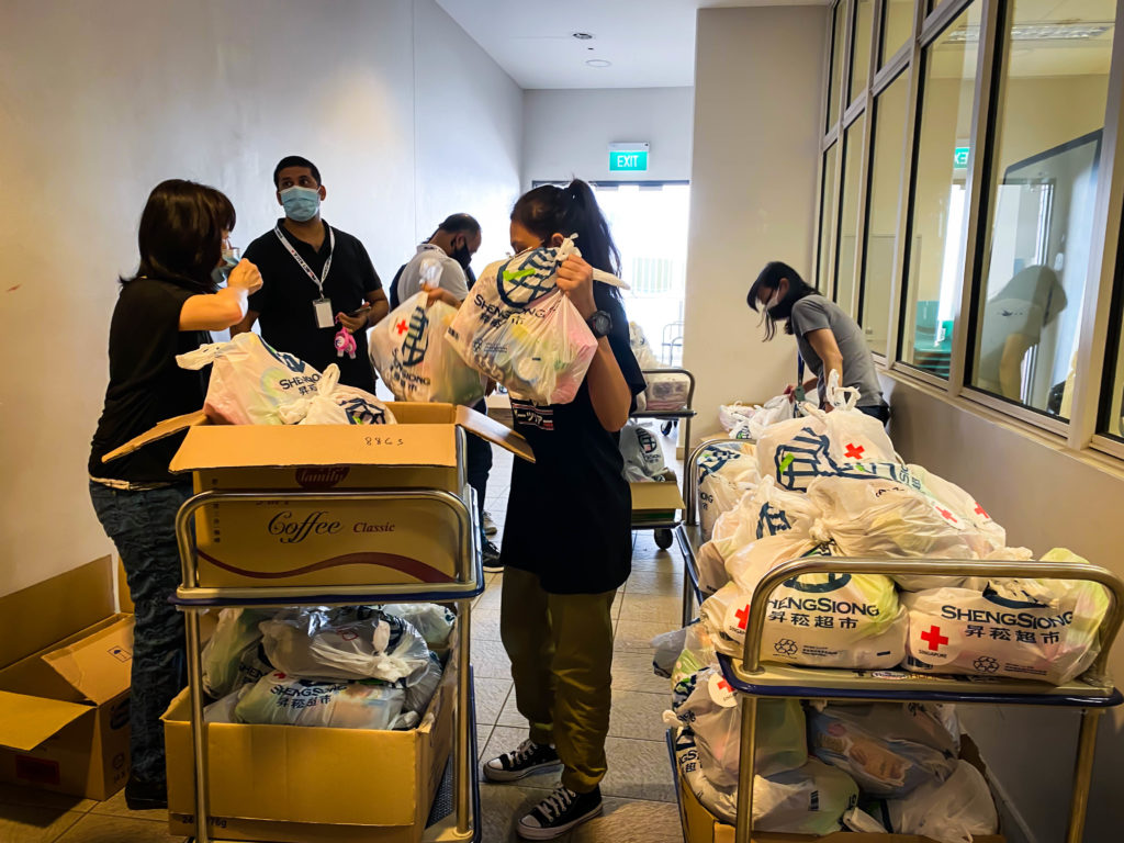 Volunteers packing the bundles sets